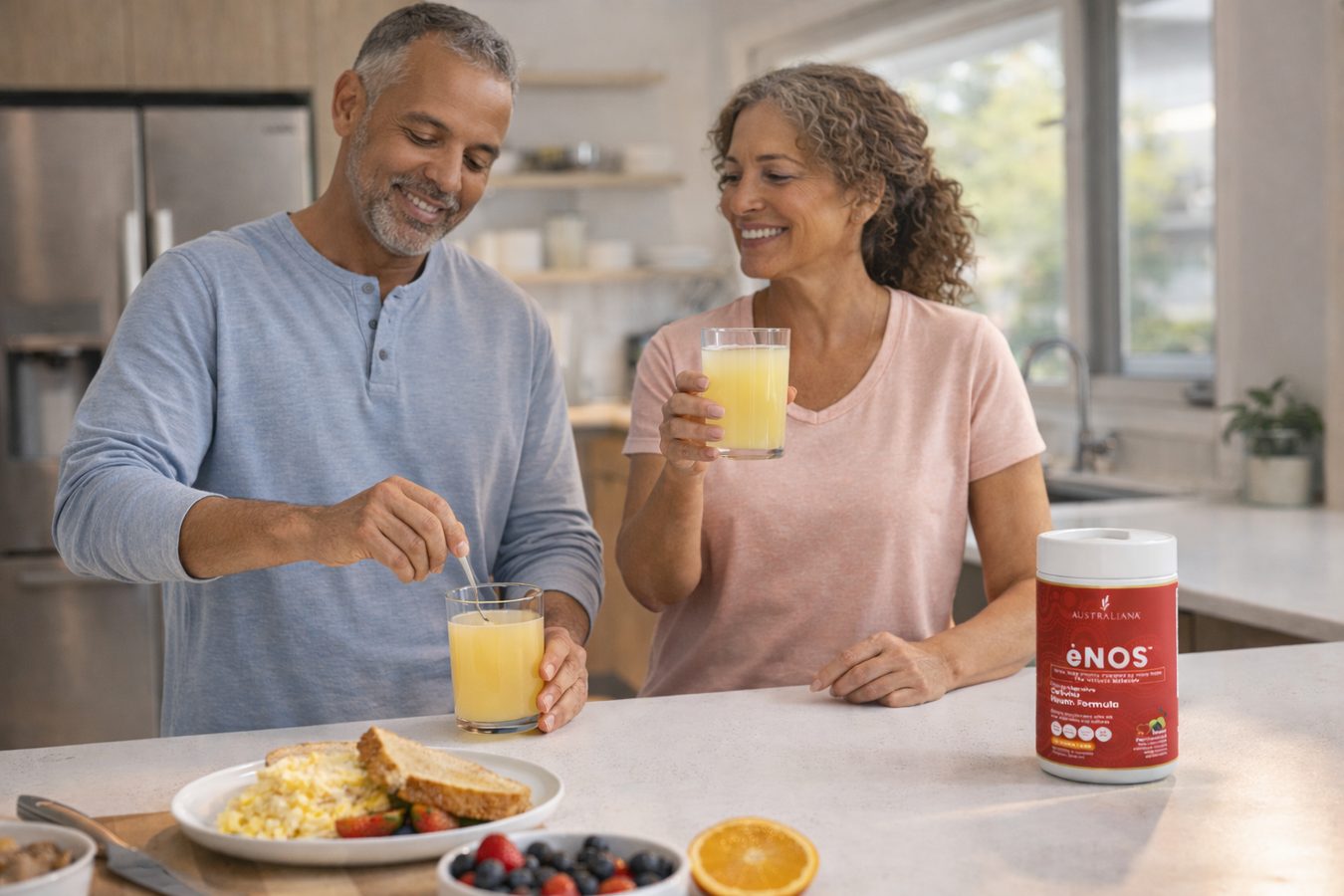 A couple in their sunlit kitchen enjoying their daily glass of ėNOS